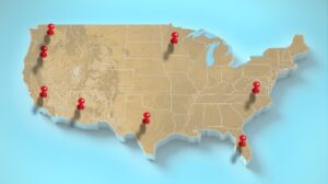 Map of the United States with location pins highlighting key states for multi-state employee handbook compliance.