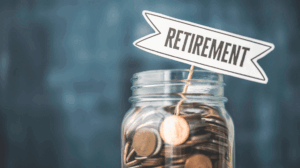 Stack of coins and retirement savings jar symbolizing California’s CalSavers program for employee retirement savings.